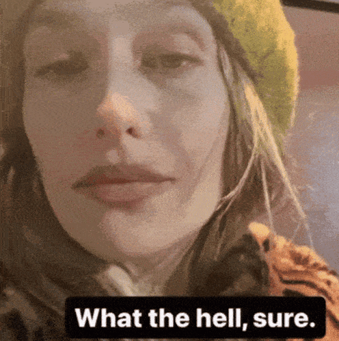 Woman in Green Hat and Tiger Print Shirt Saying What The Hell Sure