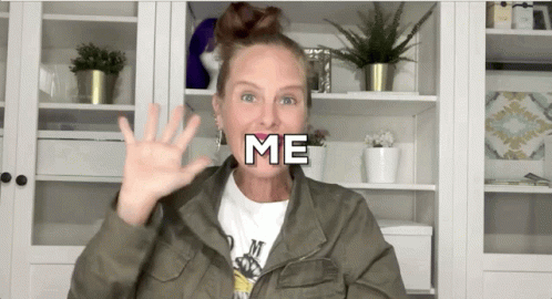 Woman In Green Jacket Waving GIF