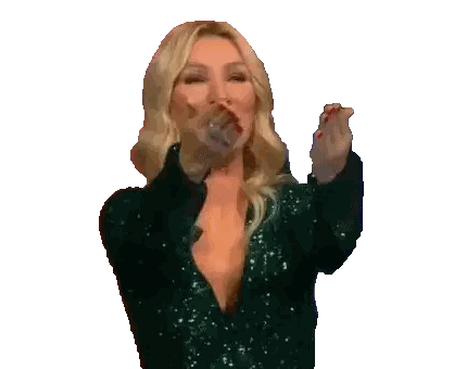 Woman in Green Sequin Dress Clapping