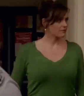 Woman in Green Shirt Next to Man