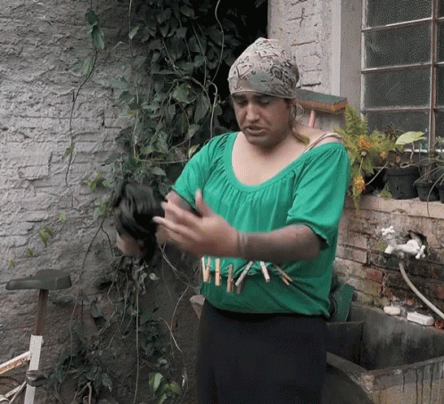 Woman in Green Shirt Saying A