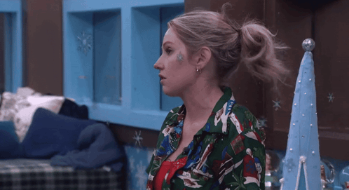 Woman In Green Shirt Saying Christmas GIF