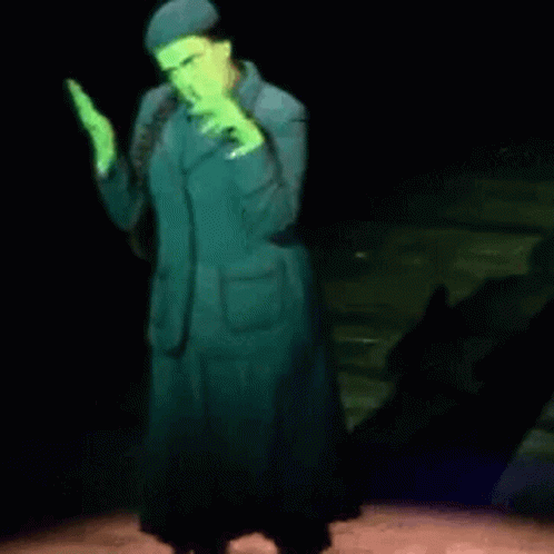 Woman In Green Suit Dancing On Stage GIF