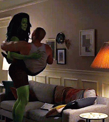 Woman in Green Tights Carrying Man