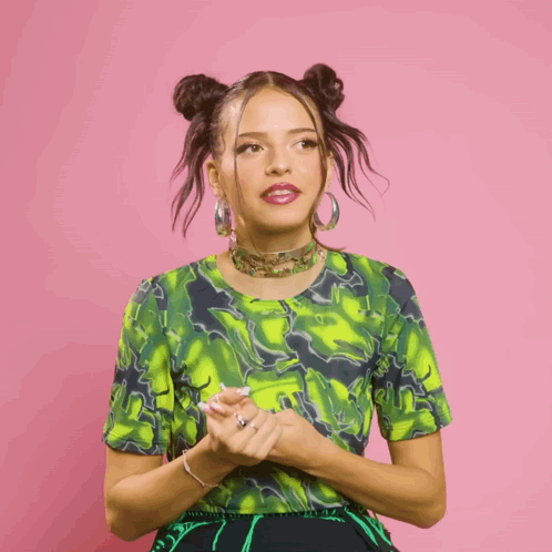 Woman In Green Top And Earrings Making Gesture GIF