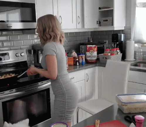 Woman in Grey Dress Cooking