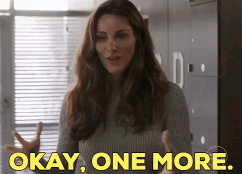 Woman in Grey Sweater Saying Okay