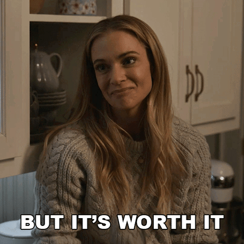 Woman In Grey Sweater Smiling Saying But It's Worth It GIF
