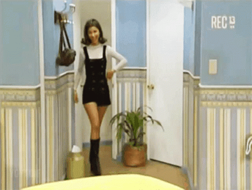 Woman in Hallway With Rec 19 Sign