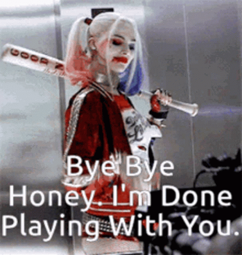 Woman In Harley Quinn Costume Holding Bat And Trumpet GIF
