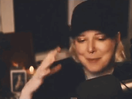 Woman In Hat And Headphones Making Funny Face GIF