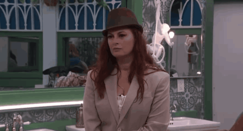 Woman in Hat and Suit at Sink