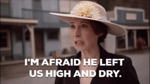 Woman In Hat And Suit Says I'm Afraid He Left Us High And Dry GIF
