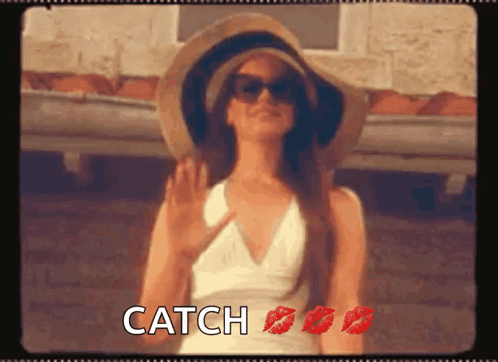 Woman In Hat And Sunglasses With Red Lipstick Says Catch GIF