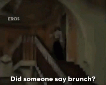 Woman in Hat Holding Wine Saying Brunch