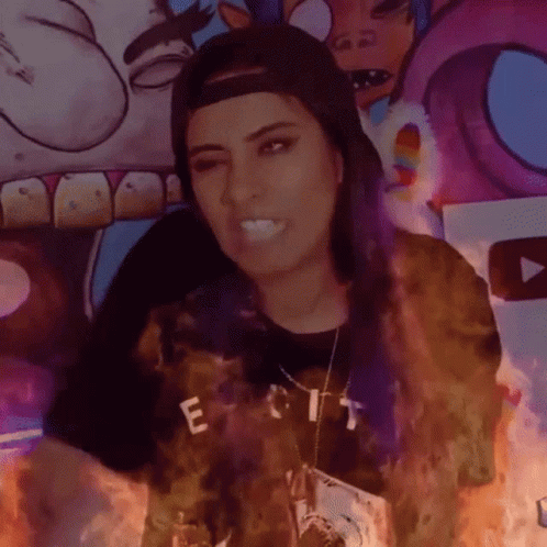 Woman in Hat with T-Shirt Saying Exit Is On Fire