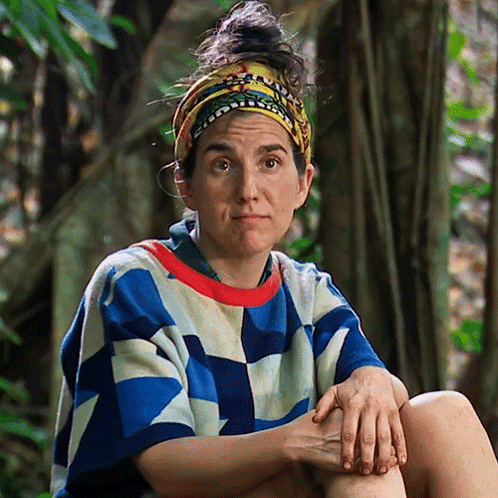 Woman in Headband and Colorful Shirt Hands on Knees
