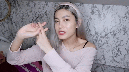 Woman In Headband Making Peace Sign GIF