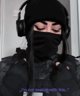 Woman In Headphones And Black Mask Says I'm Not Dealing With This GIF