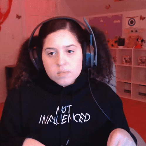 Woman In Headphones And Black Sweatshirt Saying Not Influenced GIF