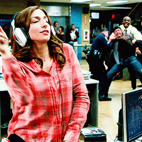 Woman In Headphones And Plaid Shirt Dancing GIF