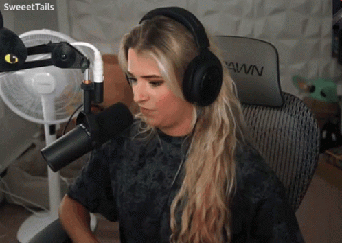 Woman in Headphones at Microphone with Pawn Chair