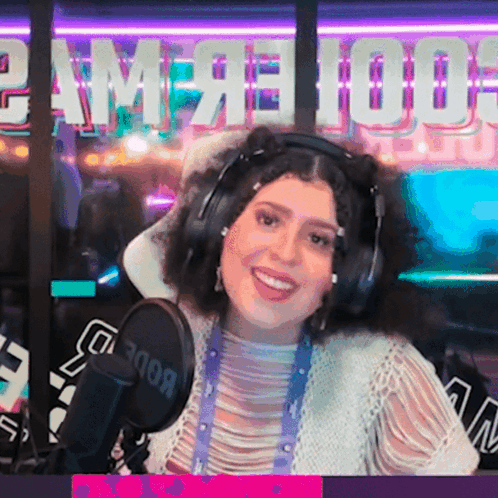 Woman in Headphones in Front of Rode Microphone