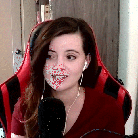 Woman In Headphones Sitting In Red Chair GIF
