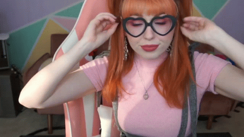 Woman in Heart-Shaped Glasses and Pink Top