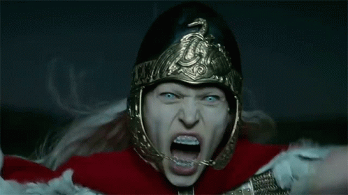 Woman in Helmet and Armor Screaming