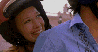 Woman In Helmet Smiling At Man GIF