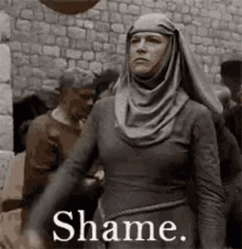 Woman in Hijab at Stone Wall Shame