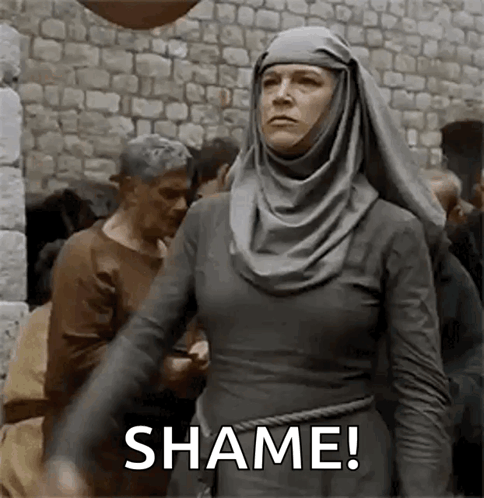 Woman in Hijab Shame Gesture Brick Wall