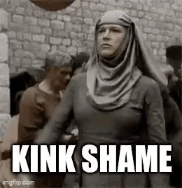 Woman in Hijab Standing in Front of Stone Wall Saying Kink Shame