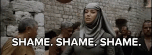 Woman in Hijab Talking to Man in Crowd