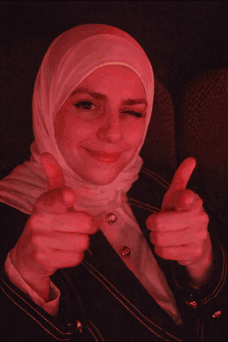 Woman in Hijab Thumbs Up Saying Pew Pew Pew