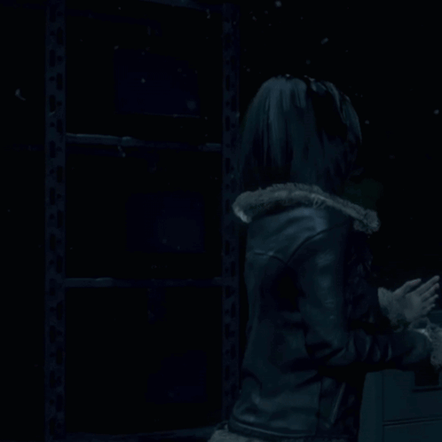Woman In Hooded Jacket Standing In Dark GIF