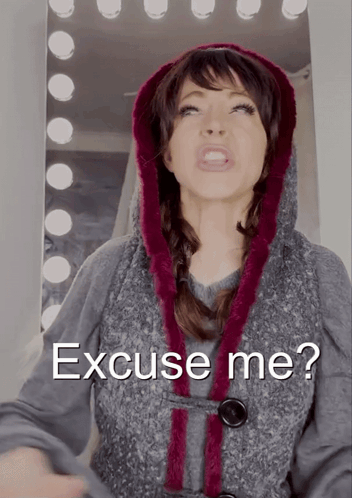 Woman in Hooded Vest with Excuse Me