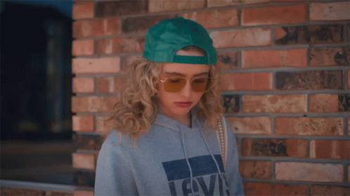 Woman in Hoodie and Sunglasses