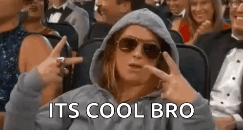 Woman In Hoodie And Sunglasses Making Peace Sign In Crowd GIF