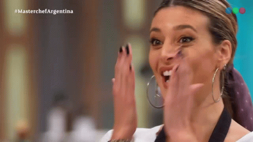 Woman in Hoop Earrings Clapping MasterChef Argentina