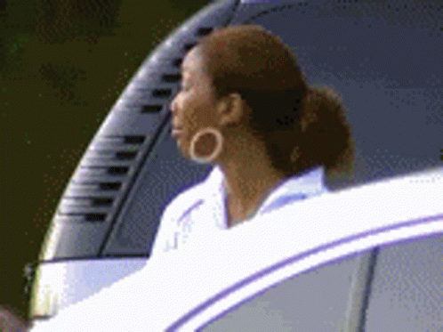 Woman In Hoop Earrings Looking Out Car Window GIF