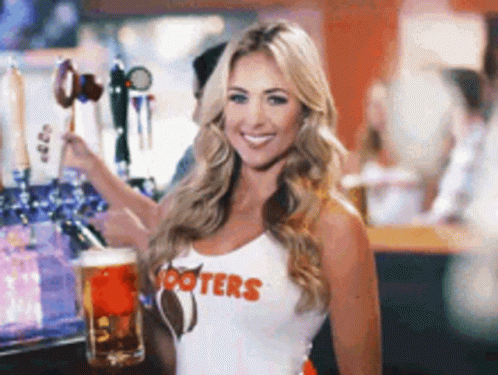 Woman In Hooters Shirt Holding Beer GIF