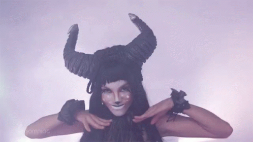 Woman In Horned Hat Making Funny Face GIF