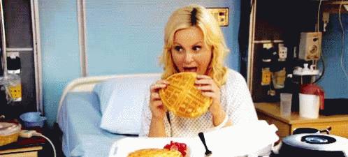 Woman in Hospital Bed Eating Waffles