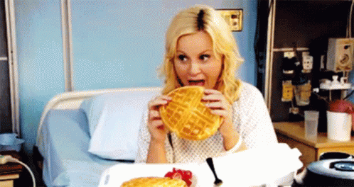 Woman in Hospital Bed Eating Waffles