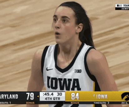 Woman in Iowa Jersey on Basketball Court
