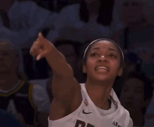 Woman in Jersey Saying Dream Pointing