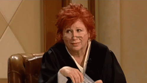 Woman in Judge Robe Holding Paper