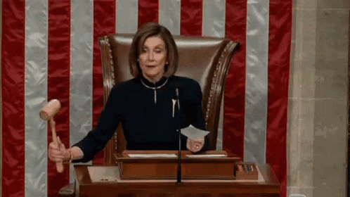 Woman In Judge's Chair Holding Hammer GIF